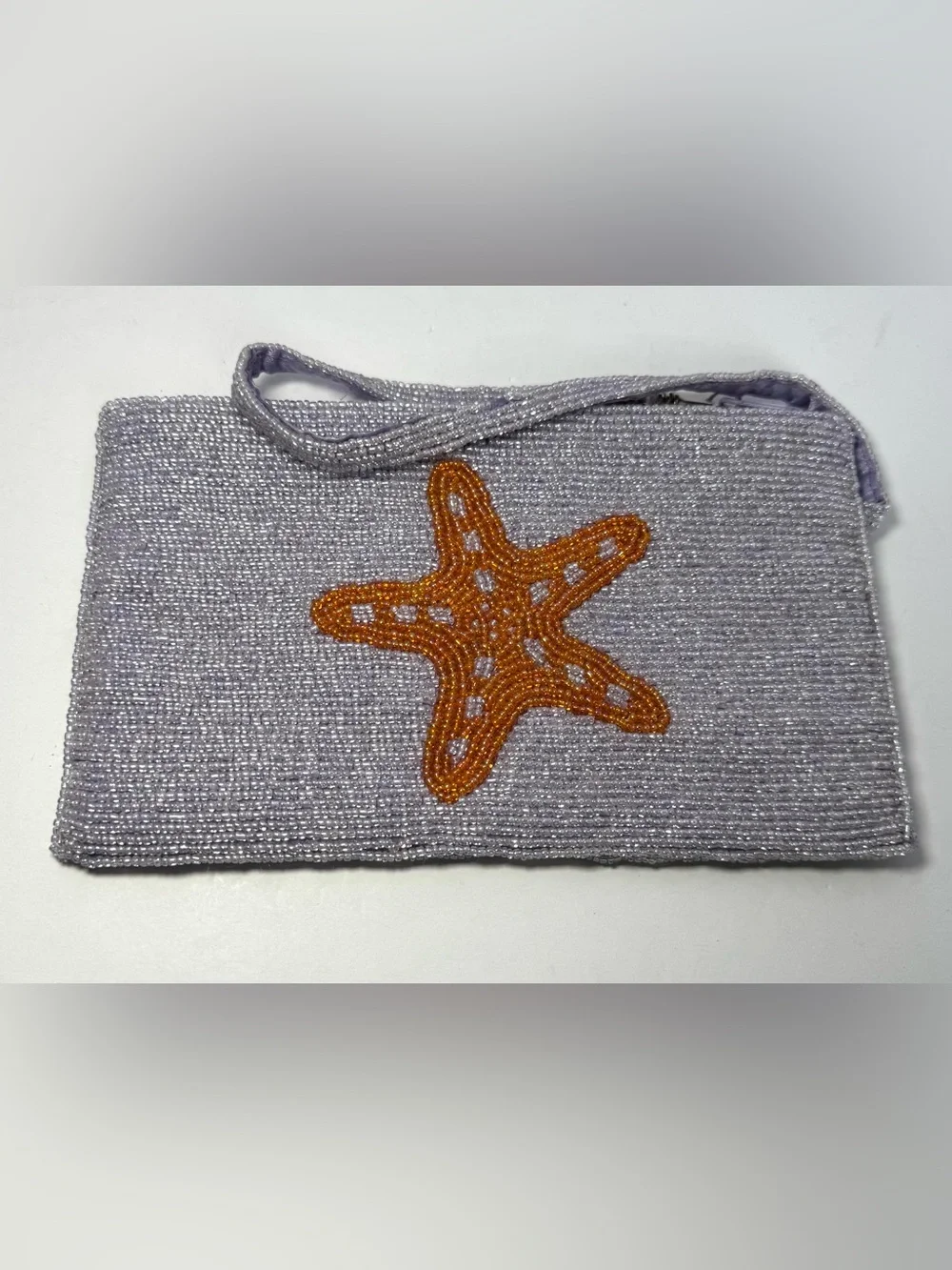 Viral K.C. Malhan hand-beaded starfish wristlet clutch